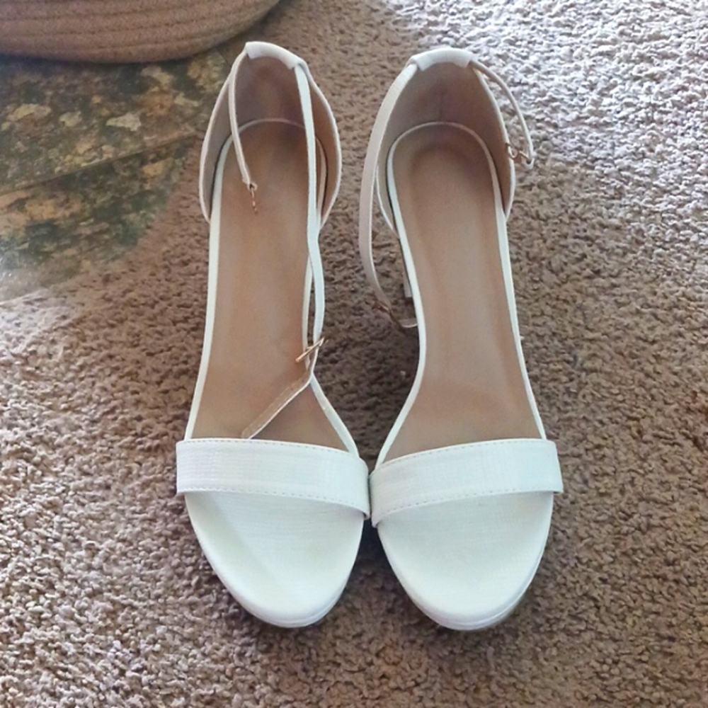 Unworn white high heels